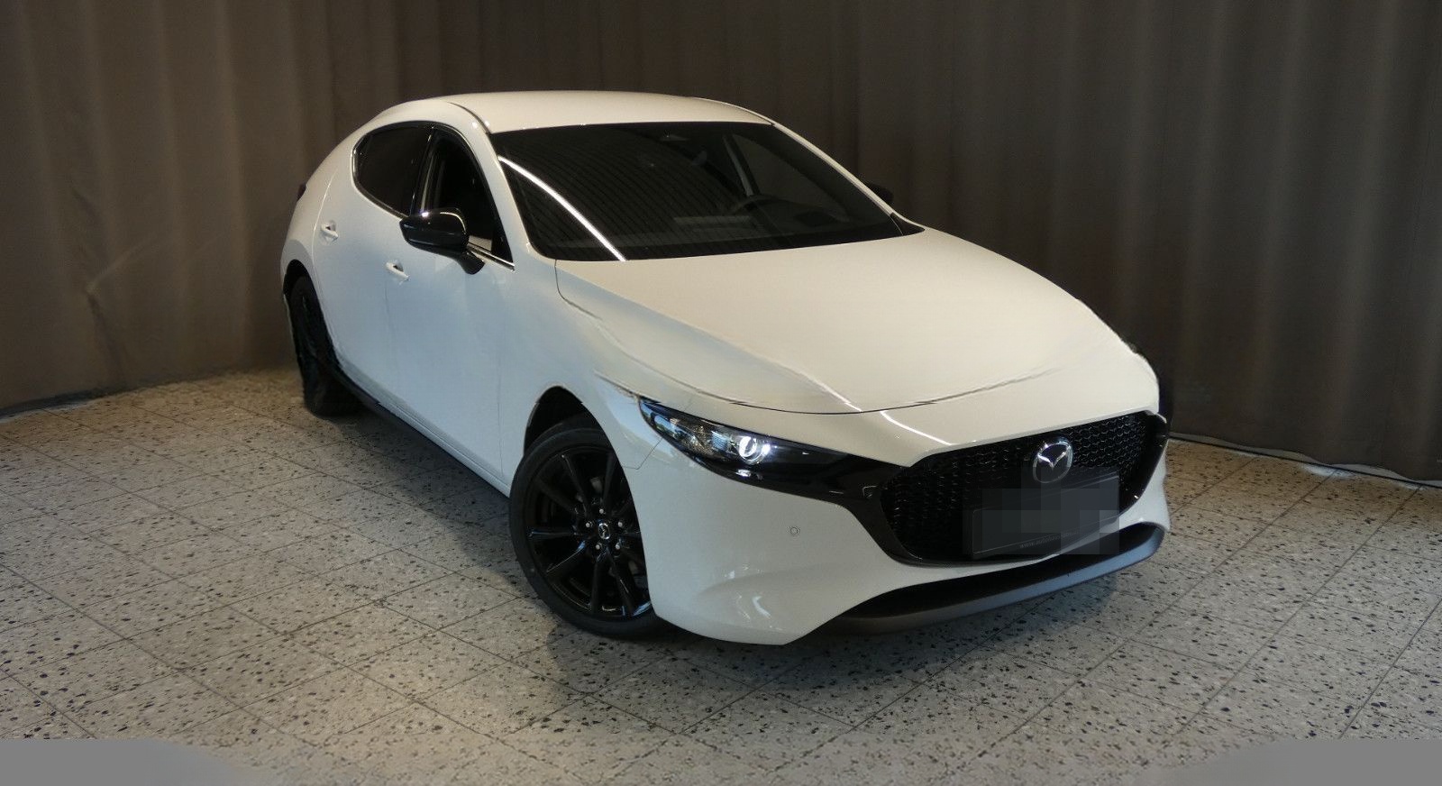 Mazda 3 e-SKYACTIV G 140 2,5 Ltr. Homura foto 1